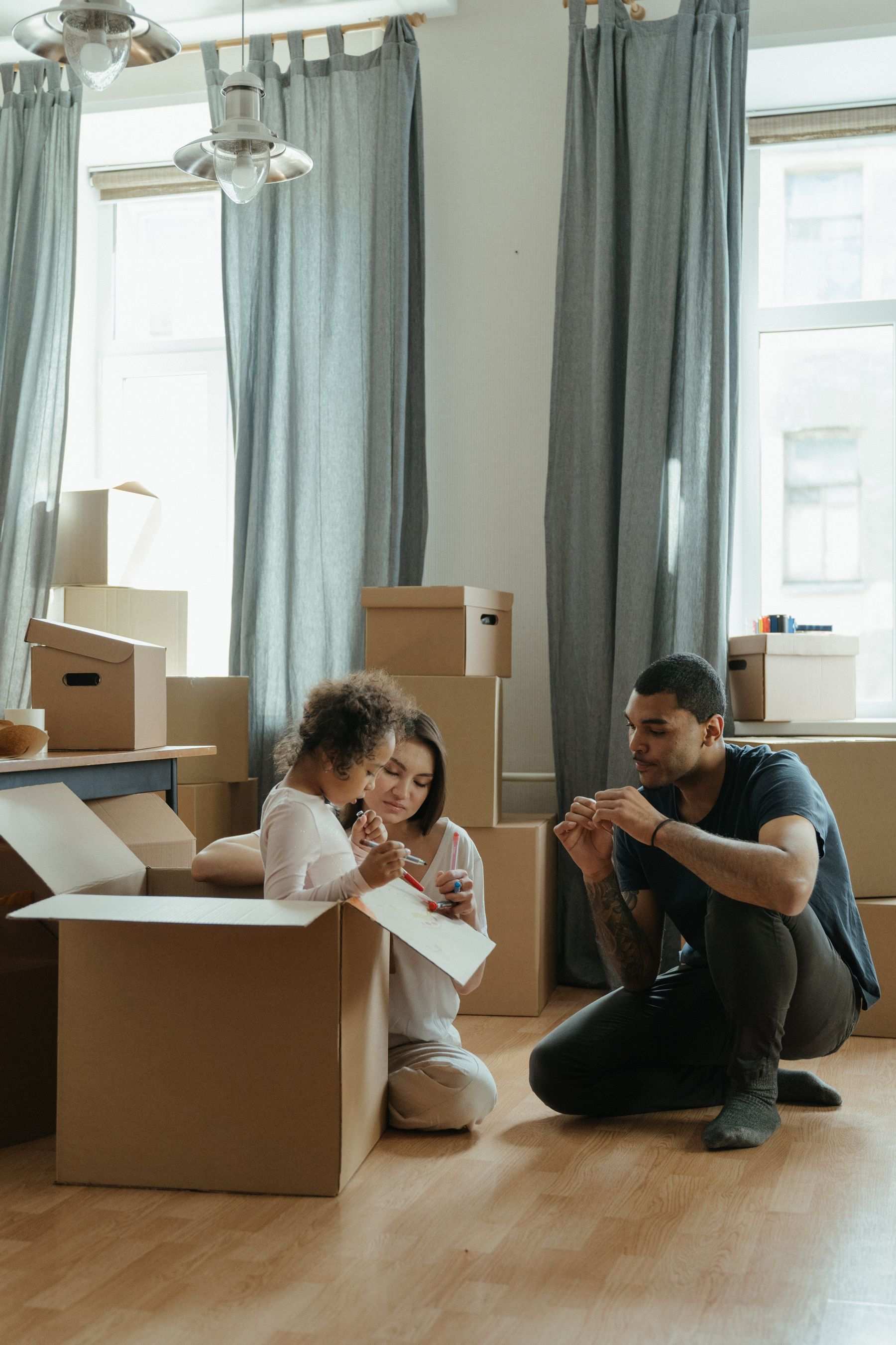 A family packing moving boxes